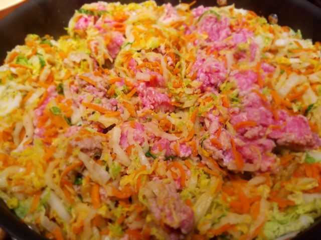 Raw Ground Pork Gets Added